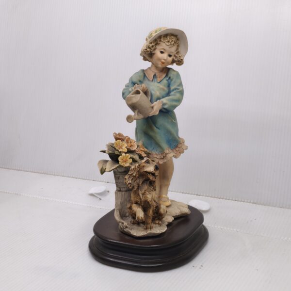 Nurturing Moments: Handcrafted Scene of Girl, Pup & Garden Blooms