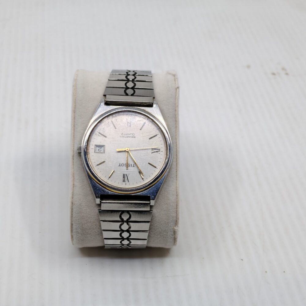 Tissot vintage quartz watch | Roman numeral silver dial | Swiss watch with patterned bracelet | Classic men’s wristwatch with date